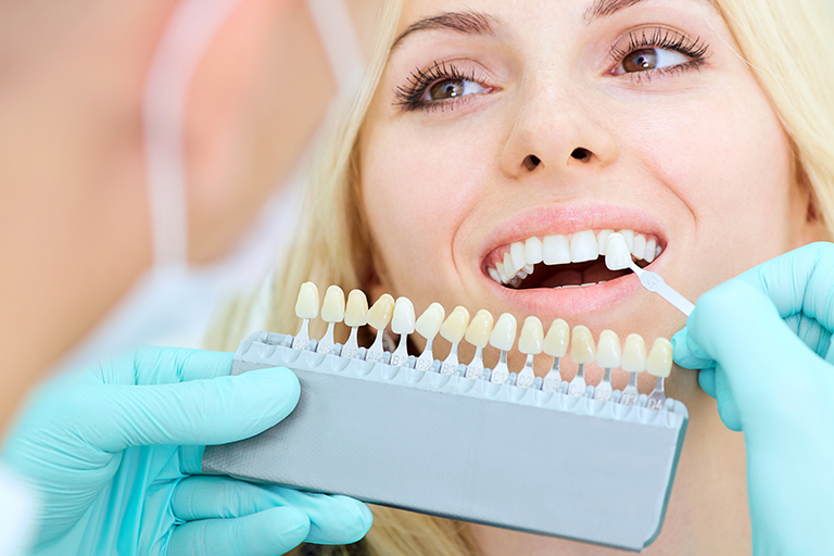 Closeup of a girl with beautiful smile at the dentist.