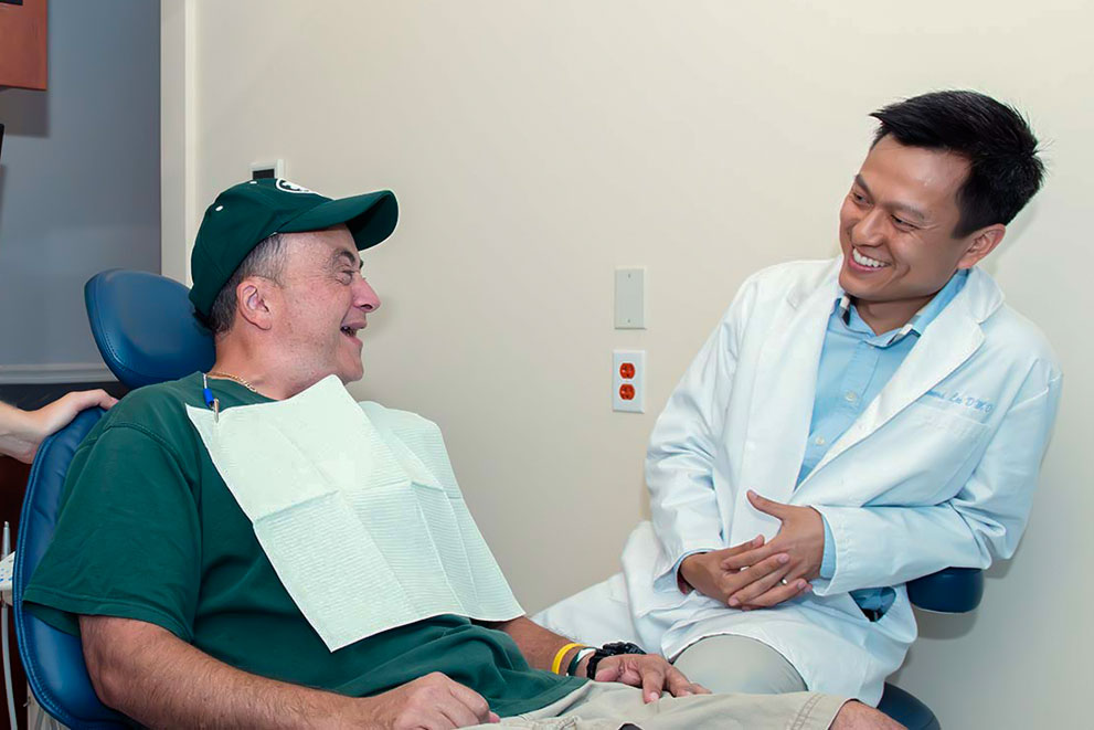 Dr. Lee chatting with his patient